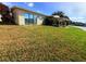 Large grassy lawn with partial water views and home visible at 17444 2Nd E St, Redington Shores, FL 33708