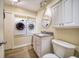 Laundry room with washer, dryer, and vanity at 17444 2Nd E St, Redington Shores, FL 33708