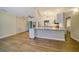 Living area with hardwood floors and kitchen view at 17444 2Nd E St, Redington Shores, FL 33708