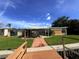 Back of house with patio, showing some damage at 17444 2Nd E St, Redington Shores, FL 33708
