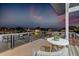 Evening view from the balcony, featuring neighborhood scenery and outdoor seating at 1954 Iowa Ne Ave, St Petersburg, FL 33703