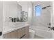 Bathroom features white countertops, wood cabinets, and a soaking tub at 1954 Iowa Ne Ave, St Petersburg, FL 33703