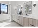 Bathroom with dual sinks, modern fixtures and finishes at 1954 Iowa Ne Ave, St Petersburg, FL 33703
