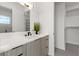 Modern bathroom features marble countertops, wood cabinets, and a soaking tub at 1954 Iowa Ne Ave, St Petersburg, FL 33703