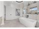 Modern bathroom with a freestanding tub, glass shower, and stylish fixtures at 1954 Iowa Ne Ave, St Petersburg, FL 33703