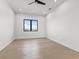 Bright bedroom with hardwood floors and black window trim at 1954 Iowa Ne Ave, St Petersburg, FL 33703