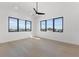 Bright bedroom with hardwood floors and two large windows at 1954 Iowa Ne Ave, St Petersburg, FL 33703