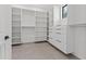 Spacious walk-in closet featuring custom shelving and drawers at 1954 Iowa Ne Ave, St Petersburg, FL 33703