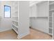 Walk-in closet with custom white shelving and a window at 1954 Iowa Ne Ave, St Petersburg, FL 33703