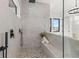 Contemporary shower with built-in seat and pebble flooring at 1954 Iowa Ne Ave, St Petersburg, FL 33703