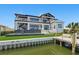 Luxurious waterfront home boasts modern design, balcony, pool and private dock access at 1954 Iowa Ne Ave, St Petersburg, FL 33703