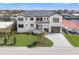 Beautiful two-story home with manicured lawn, paver driveway, and a scenic waterfront view at 1954 Iowa Ne Ave, St Petersburg, FL 33703