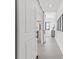 Bright hallway with sliding barn door entry, modern decor, and sleek flooring at 1954 Iowa Ne Ave, St Petersburg, FL 33703