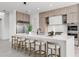 Bright, spacious kitchen with large island, modern cabinetry, stainless steel appliances and bar stool seating at 1954 Iowa Ne Ave, St Petersburg, FL 33703