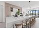 Gourmet kitchen featuring white quartz countertops, light wood cabinetry, and stainless steel Wolf appliances at 1954 Iowa Ne Ave, St Petersburg, FL 33703
