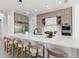 Modern kitchen featuring large center island with bar stool seating and stainless steel appliances at 1954 Iowa Ne Ave, St Petersburg, FL 33703