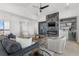 Stunning living room features a fireplace, sleek wine storage, and hardwood floors at 1954 Iowa Ne Ave, St Petersburg, FL 33703