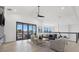 Open living area with vaulted ceiling and glass doors leading to outdoor space at 1954 Iowa Ne Ave, St Petersburg, FL 33703