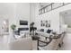 Bright living room with soaring ceilings, modern fireplace, comfortable seating, and a sleek contemporary design at 1954 Iowa Ne Ave, St Petersburg, FL 33703