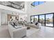 Expansive open-concept living space with modern furnishings, high ceilings, and seamless indoor-outdoor flow at 1954 Iowa Ne Ave, St Petersburg, FL 33703