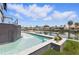 Backyard swimming pool and dock by canal on a sunny day at 1954 Iowa Ne Ave, St Petersburg, FL 33703