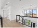 Hallway with overhead lights, large windows, wood floors, and a staircase at 1954 Iowa Ne Ave, St Petersburg, FL 33703