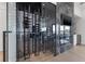 Sophisticated wine room with glass doors near the fireplace at 1954 Iowa Ne Ave, St Petersburg, FL 33703