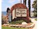 A brick sign welcomes visitors to Dunedin, Florida, with a scenic view of the water in the background at 200 Glennes Ln # 111, Dunedin, FL 34698