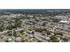 A beautiful aerial view of a neighborhood showcasing lush greenery, and manicured streets at 2132 Academy Dr, Clearwater, FL 33764