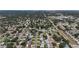 An aerial view showing homes nestled among mature trees with ample green spaces at 2132 Academy Dr, Clearwater, FL 33764