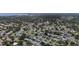 An aerial view of a neighborhood, highlighting mature trees and charming residences, offering a serene and suburban setting at 2132 Academy Dr, Clearwater, FL 33764