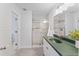 Updated bathroom with large shower stall, green countertops, and white vanity at 2132 Academy Dr, Clearwater, FL 33764