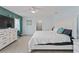 Bright bedroom with ceiling fan, ensuite, and large dresser at 2132 Academy Dr, Clearwater, FL 33764