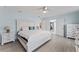 Spacious bedroom features white trim and view into hallway and ensuite at 2132 Academy Dr, Clearwater, FL 33764