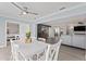 Open concept dining area with view into kitchen and living room at 2132 Academy Dr, Clearwater, FL 33764