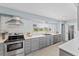 This kitchen features stainless appliances, and white quartz countertops at 2132 Academy Dr, Clearwater, FL 33764
