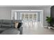 Open-concept living room showcasing dining area with backyard views at 2132 Academy Dr, Clearwater, FL 33764