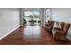 Relaxing living room with hardwood floors, access to the patio, and wicker chairs at 2622 Bonterra Blvd, Valrico, FL 33594
