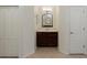 Small bathroom with single vanity and storage at 2622 Bonterra Blvd, Valrico, FL 33594