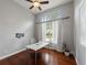 Home office with hardwood floors, large window, and built-in shelving at 2622 Bonterra Blvd, Valrico, FL 33594