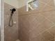 Shower with tile surround and a window at 2622 Bonterra Blvd, Valrico, FL 33594