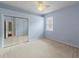 Spacious bedroom with mirrored closet doors and a ceiling fan at 2622 Bonterra Blvd, Valrico, FL 33594