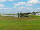 Spacious backyard with pond and grassy area at 2622 Bonterra Blvd, Valrico, FL 33594
