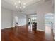 Elegant dining room with hardwood floors, chandelier, and access to the patio at 2622 Bonterra Blvd, Valrico, FL 33594