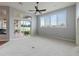 Living room with carpeting, sliding doors to patio, and ceiling fan at 2622 Bonterra Blvd, Valrico, FL 33594