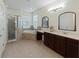 Elegant bathroom with double vanity, soaking tub, and separate shower at 2622 Bonterra Blvd, Valrico, FL 33594