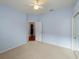 Light and airy bedroom with ceiling fan and access to bathroom at 2622 Bonterra Blvd, Valrico, FL 33594