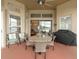 Spacious screened patio featuring a wooden table and chairs at 2622 Bonterra Blvd, Valrico, FL 33594