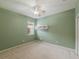 Bedroom with ceiling fan and neutral wall color at 2622 Bonterra Blvd, Valrico, FL 33594