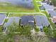 Aerial view of house and surrounding area, including lake at 2622 Bonterra Blvd, Valrico, FL 33594